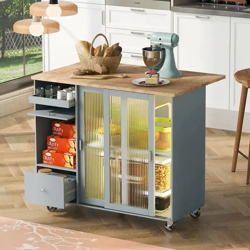 Carrello isola da cucina con piano a ribalta, illuminazione LED e ante in vetro scanalato su ruote