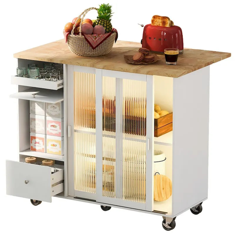 Carrello isola da cucina con piano a ribalta, illuminazione LED e ante in vetro scanalato su ruote