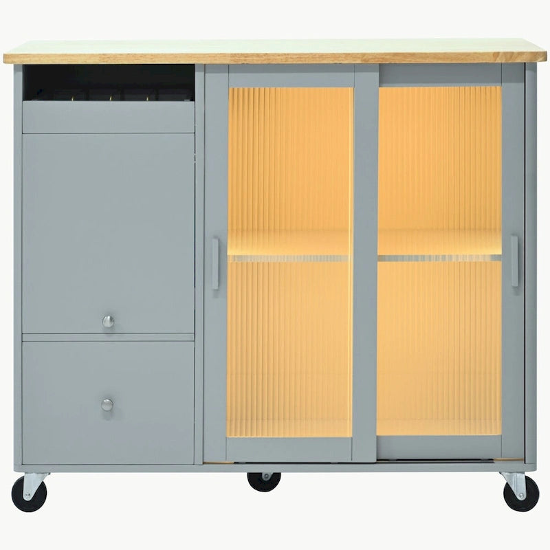 Carrello isola da cucina con piano a ribalta, illuminazione LED e ante in vetro scanalato su ruote